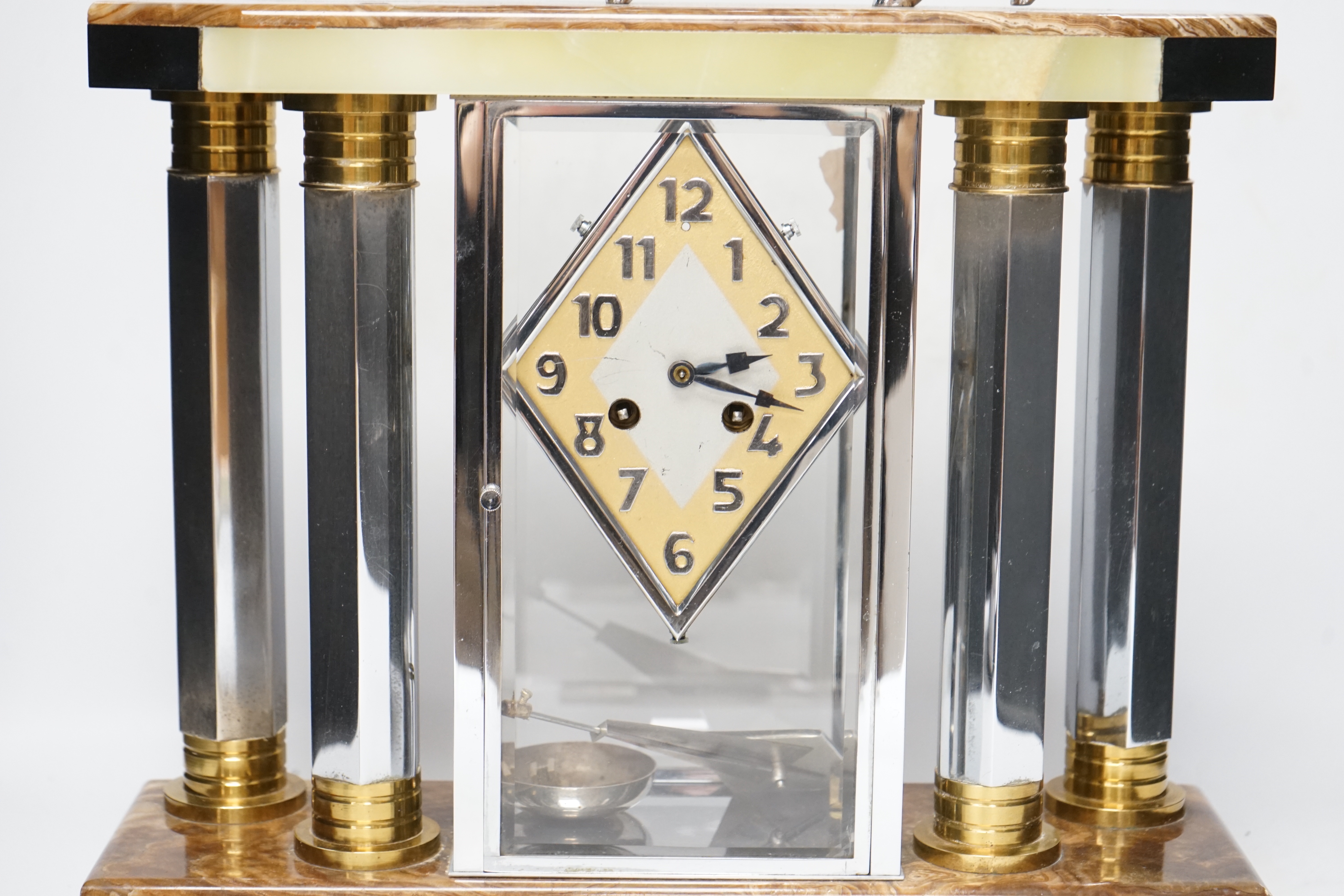 A French chrome, bronze and marble Art Deco 4 glass clock with two pedestal vase garnitures and a Wolf mount, attributed to Michel Decoux